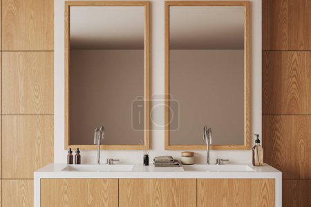 Téléchargez les photos : Intérieur de salle de bain moderne avec des murs en panneaux blancs et en bois, double lavabo sur armoire en bois et deux miroirs verticaux. Rendu 3d - en image libre de droit