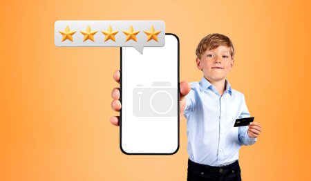 Photo for Child hand showing a mockup phone screen, orange background. Giving five stars, high rating and share positive experience online. Concept of review and customer service - Royalty Free Image