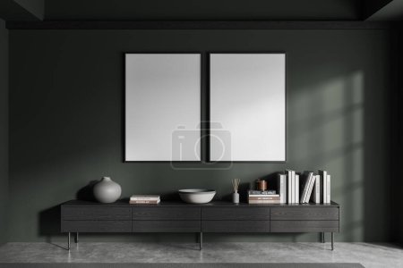 Téléchargez les photos : Salon intérieur vert avec buffet en bois noir et bibliothèque à la maison. Design scandinave minimaliste et sol en béton gris. Deux maquettes d'affiches en toile en rang. rendu 3D - en image libre de droit