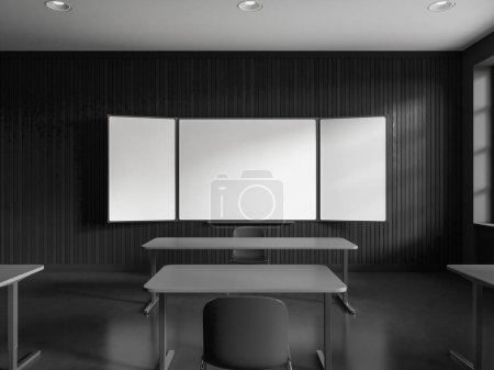 Foto de Interior de la elegante aula de la escuela con paredes grises, piso de hormigón, filas de mesas grises con sillas y maqueta de pizarra blanca. renderizado 3d - Imagen libre de derechos