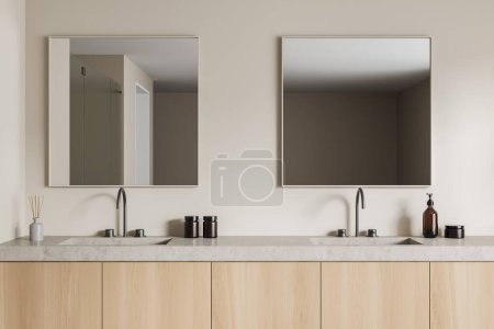 Photo for Beige bathroom interior with double sink and two square mirrors, wooden shelves. Bath accessories, reed diffuser and hand soap bottle. 3D rendering - Royalty Free Image