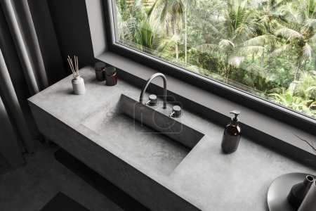 Photo for Top view of dark bathroom interior with sink and panoramic window on tropics. Washbasin in modern hotel studio corner with bath accessories. 3D rendering - Royalty Free Image