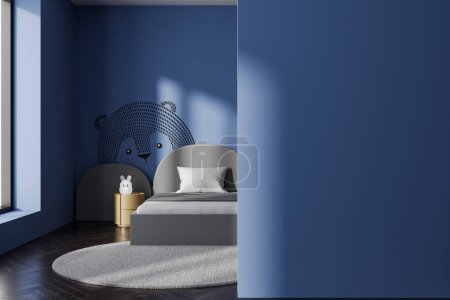 Photo for Interior of modern child room with blue walls, dark wooden floor, comfortable gray bed and round bedside table. Mock up wall on the right. 3d rendering - Royalty Free Image