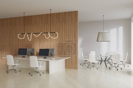 Foto de Elegante interior de la sala de oficina con sillones y mesa con ordenadores PC, vista lateral, sala de conferencias y coworking, suelo de hormigón ligero. Renderizado 3D - Imagen libre de derechos