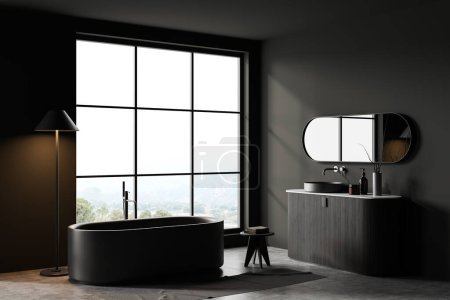 Photo for Dark bathroom interior with sink and bathtub with lamp and stool, side view dresser with accessories and panoramic window on countryside. Bathing corner with decoration. 3D rendering - Royalty Free Image
