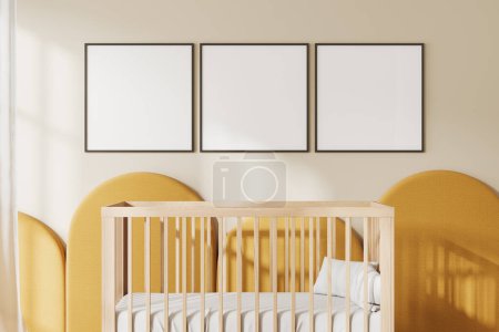 Foto de Acogedor interior de la habitación del bebé del hogar beige con cuna de madera y ropa de cama. Espacio de relax amarillo para niño. Espacio de guardería, dormitorio con maqueta de carteles de lona cuadrada en fila. Renderizado 3D - Imagen libre de derechos