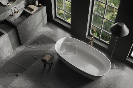 Photo for Top view of modern bathroom interior with bathtub and sink with mirror, carpet on grey concrete floor. Bathing corner in home apartment. Panoramic window on tropics. 3D rendering - Royalty Free Image