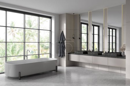 Téléchargez les photos : Hôtel de luxe salle de bain intérieure avec triple lavabo avec miroirs, vue latérale, baignoire et serviette dans le coin. Fenêtre panoramique sur les tropiques. rendu 3D - en image libre de droit