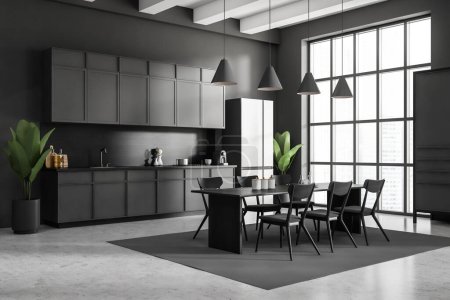 Photo for Dark kitchen interior with chairs and dining table, side view, carpet on grey concrete floor. Kitchenware and appliances on deck, fridge and plant. Panoramic window on city view. 3D rendering - Royalty Free Image