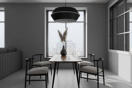 Photo for Dark living room interior with dining table and chairs, grey concrete floor. Panoramic window on Singapore city view. Lamp and vase with dried flower. 3D rendering - Royalty Free Image