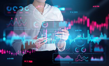 Photo for Businesswoman working with tablet. Colorful stock market analysis, double exposure, forex hud with numbers and lines. Concept of online trading - Royalty Free Image