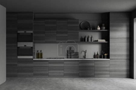 Photo for Dark kitchen interior with kitchenware on shelves, grey concrete floor. Black wooden cooking space with minimalist decoration and concealed design. 3D rendering - Royalty Free Image