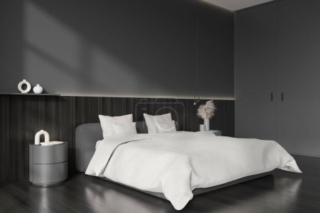 Photo for Dark bedroom interior bed and nightstand with art decoration, side view, black hardwood floor. Minimalist hotel sleep area and invisible closet door. Mockup empty wall. 3D rendering - Royalty Free Image