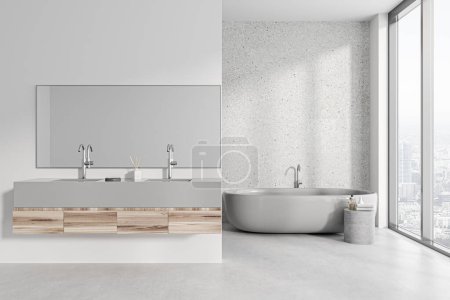 Téléchargez les photos : Intérieur de salle de bain moderne avec murs en pierre blanche, sol en béton, baignoire blanche confortable et double lavabo avec long miroir debout sur le comptoir blanc et en bois. Rendu 3d - en image libre de droit