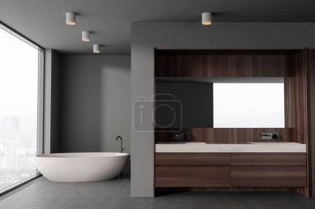 Téléchargez les photos : Intérieur de la salle de bain élégante avec des murs en bois gris et foncé, sol en béton, baignoire blanche confortable et double lavabo avec un long miroir suspendu au-dessus. Rendu 3d - en image libre de droit