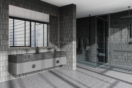 Téléchargez les photos : Coin de la salle de bain élégante avec des murs de tuiles grises, sol en béton, confortable lavabo double gris avec un long miroir suspendu au-dessus de lui cabine de douche avec des murs en verre. Rendu 3d - en image libre de droit