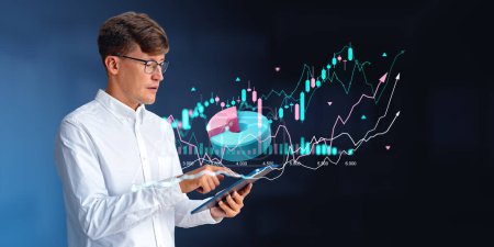Photo for Businessman finger touching tablet, using gadget for analysis and research. Double exposure with infographics, pie chart and rising candlesticks hud. Concept of online trading and investment - Royalty Free Image