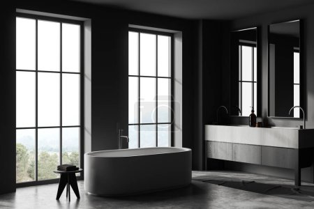 Photo for Corner of stylish bathroom with dark gray walls, concrete floor, massive stone double sink with two mirrors, comfortable bathtub and two windows with mountain view. 3d rendering - Royalty Free Image