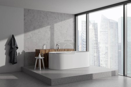 Photo for Stylish bathroom interior with bathtub on podium with bath accessories, side view. Panoramic window on Singapore city view. 3D rendering - Royalty Free Image