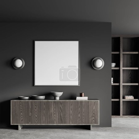Foto de Interior de la elegante sala de estar con paredes grises, piso de hormigón, librería de madera oscura y vestidor con la maqueta cuadrada encima de él. renderizado 3d - Imagen libre de derechos