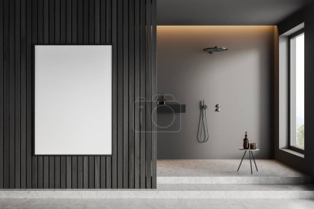 Foto de Interior de baño oscuro con ducha, taburete con accesorios en podio de hormigón gris. Estudio de hotel con ventana panorámica al campo. Cartel de lienzo burlón. Renderizado 3D - Imagen libre de derechos