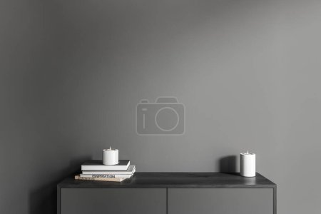 Photo for Front view on dark living room interior with empty grey wall, candles, books, sideboard. Concept of minimalist design, modern art. 3d rendering - Royalty Free Image