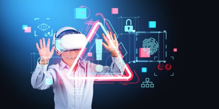 Photo for School kid wearing vr glasses, hands touching red alert symbol virtual screen with diverse cybersecurity icons. Concept of metaverse, kids safe online and parental control - Royalty Free Image