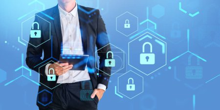Businessman holding tablet with hand in pocket, double exposure with lock icons circuit and data privacy. Concept of online security, business information protection and technology