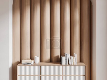 Foto de Interior de la moderna sala de estar con paredes blancas y de madera y elegante vestidor blanco con libros y jarrón de pie sobre ella. renderizado 3d - Imagen libre de derechos