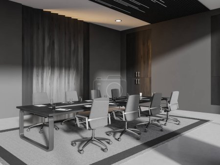 Foto de Interior oscuro de la sala de negocios con sillones de oficina grises y pizarra negra, alfombra de vista lateral sobre suelo de hormigón gris. Esquina de conferencias minimalista con muebles modernos. Renderizado 3D - Imagen libre de derechos