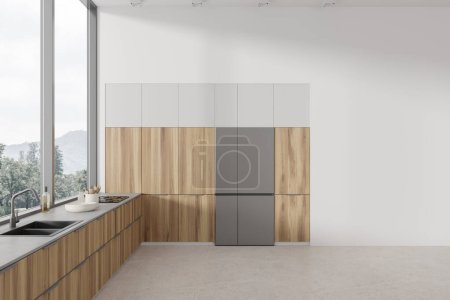 Foto de Acogedora cocina casera interior estantes de madera, nevera y lavabo con estufa y menaje de cocina minimalista. Ventana panorámica en el campo y se burlan de la pared vacía en blanco. Renderizado 3D - Imagen libre de derechos