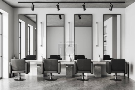 Foto de Interior de barbería blanca con grandes espejos, suelo de hormigón gris. Mesa de piedra con accesorios y sillones negros acogedores en fila, estante con botellas y cremas. Renderizado 3D - Imagen libre de derechos