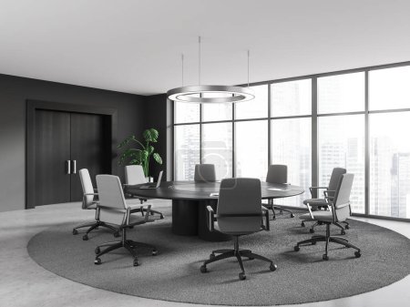 Photo for Interior of stylish meeting room with gray walls, concrete floor, round conference table with gray chairs, panoramic window with cityscape and big wooden door. 3d rendering - Royalty Free Image