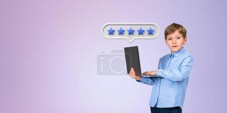 Photo for Serious little boy kid in formal clothes holding laptop and giving five star rating standing over purple background. Concept of service and product feedback and ranking. Copy space - Royalty Free Image