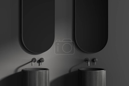 Foto de Interior del cuarto de baño oscuro con doble lavabo y espejo oval. Zona de baño minimalista con pared gris. Renderizado 3D - Imagen libre de derechos