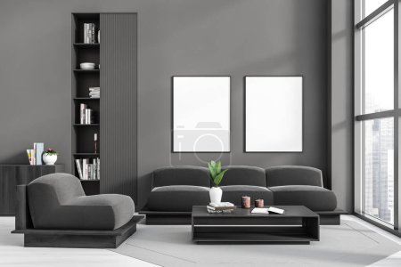 Photo for Dark living room interior with sofa and soft armchair, shelf with books and coffee table. Panoramic window on city skyscrapers, carpet on hardwood floor. Two mockup canvas posters , 3D rendering - Royalty Free Image