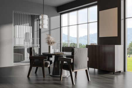 Photo for Dark living room interior with chairs and dining table, side view, drawer with decoration on hardwood floor. Panoramic window on countryside. Mock up blank poster. 3D rendering - Royalty Free Image
