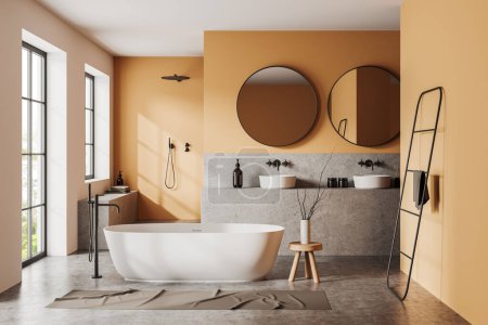 Téléchargez les photos : Intérieur de salle de bain moderne avec murs orange, sol en béton, baignoire blanche confortable, double lavabo avec deux miroirs ronds et douche à l'italienne. Rendu 3d - en image libre de droit