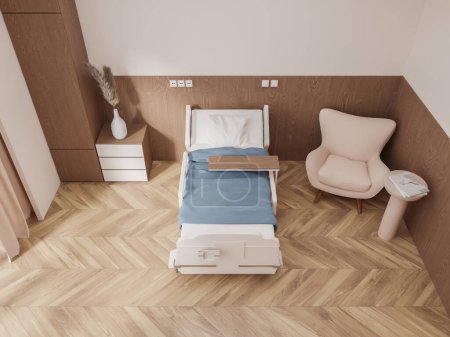 Foto de Vista superior de la moderna sala de hospital privado con paredes de color beige y madera, suelo de madera, cómoda cama con manta azul y acogedor sillón beige. renderizado 3d - Imagen libre de derechos