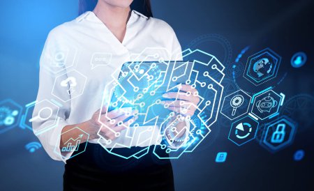Businesswoman in formal wear is holding tablet device. Digital interface with brain hologram, virtual globe, bar, pie diagrams, padlock. Dark blue background. Concept of modern business technology