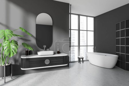 Téléchargez les photos : Intérieur salle de bain sombre avec baignoire et lavabo avec miroir ovale, vue latérale. Zone de baignade élégante avec fenêtre panoramique sur les gratte-ciel de Singapour. rendu 3D - en image libre de droit