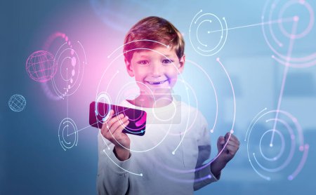 Photo for Child boy with smartphone and raised fist, happy portrait. Abstract metaverse hologram and circuit of connection in digital world, double exposure. Concept of online education - Royalty Free Image