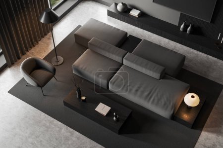 Photo for Top view of dark home living room interior with sofa, armchair and coffee table with modern art decoration. Relaxing corner and carpet on grey concrete floor. 3D rendering - Royalty Free Image