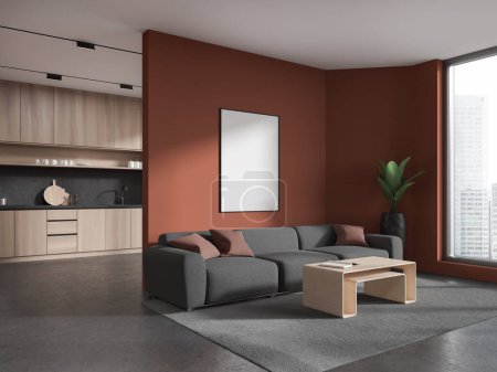 Photo for Corner of stylish living room with red walls, concrete floor, comfortable gray couch with vertical mock up poster above it and kitchen with light wooden cabinets in background. 3d rendering - Royalty Free Image