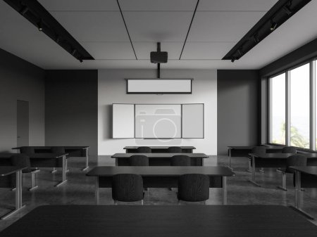 Téléchargez les photos : Intérieur d'une salle de classe élégante avec des murs blancs et gris, des rangées de tables en bois sombre et un tableau blanc blanc maquillé. Rendu 3d - en image libre de droit