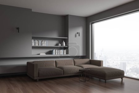 Téléchargez les photos : Intérieur gris salon avec canapé en forme de L, vue latérale étagère murale intégrée avec livres et décoration minimale. Fenêtre panoramique sur les gratte-ciel de Paris. rendu 3D - en image libre de droit
