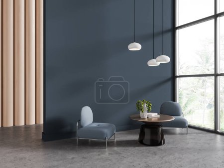 Photo for Interior of stylish living room with wooden and dark blue walls, concrete floor, two comfortable blue armchairs standing near round coffee table and big window. 3d rendering - Royalty Free Image