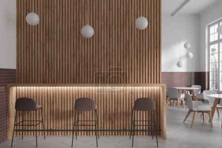 Téléchargez les photos : Intérieur du café moderne avec blanc, carrelage brun et murs en bois, sol en béton, comptoir de bar en bois avec tabourets et tables rondes avec chaises blanches. Rendu 3d - en image libre de droit