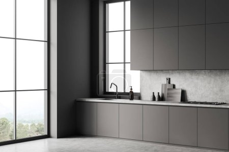 Photo for Dark kitchen interior with sink and stove, side view dresser with kitchenware on grey concrete floor. Panoramic window on countryside. 3D rendering - Royalty Free Image