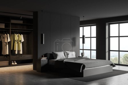 Photo for Interior of stylish bedroom with gray walls, concrete floor, comfortable gray king size bed and spacious walk in closet behind it. Big windows with mountain view. 3d rendering - Royalty Free Image